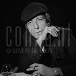 11-12-1985 Leonard Cohen in Rotterdam, The Netherlands. December 11, 1985.

[keywords]Posed, Headshot, Eye contact, Black & White image, Smoking[/keywords]